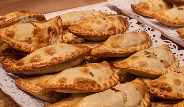 tray of freshly baked empanadas street food in colombia