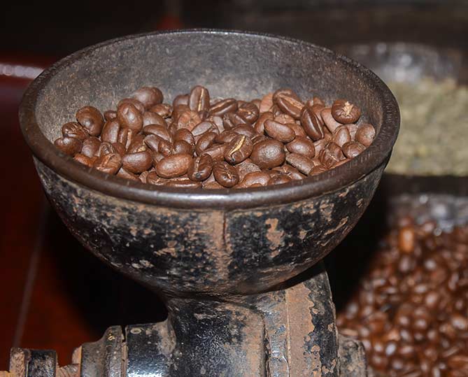 food to try in costa rica costa rican coffee beans in a grinder