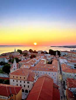 A summer evening in Zadar showing the harbour and full moon