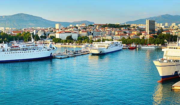 An image showing the Split harbour with ferries docked