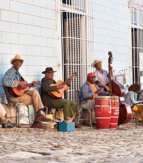 group of cuban men playing instruments in the streets of cuba