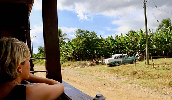 travelling by train around Cuba looking out the window at the cuban countryside