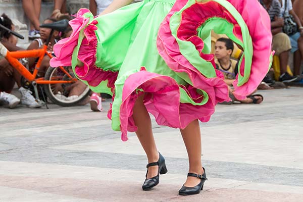 cuban woman wearing traditional salsa dress for cuban dance festival in havana