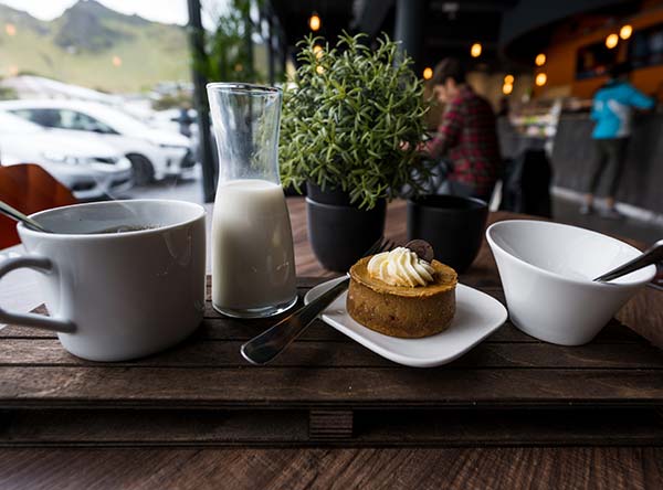 coffee and cake on a wooden table in a cafe in iceland