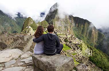 married couple on holiday in the famous incan site of machu picchu one of the highlights of their holiday tour of peru