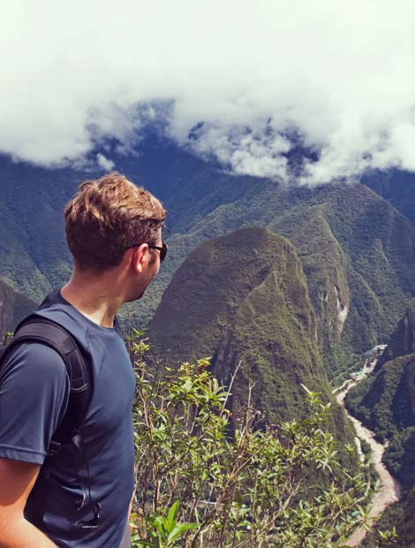 Man enroute to Machu picchu on a day trek trip excursion holiday