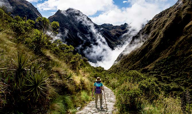 solo adventue travel tourist hiking the inca Trail on a group tour