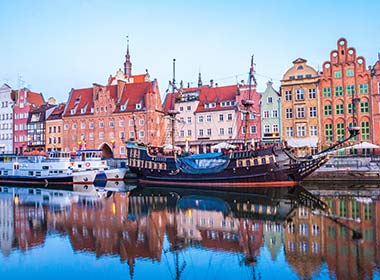 boats in the harbour at port town of gdanks on the colourful street in poland