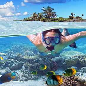 traveller snorkelling off the coast of Phuket during high season in Thailand