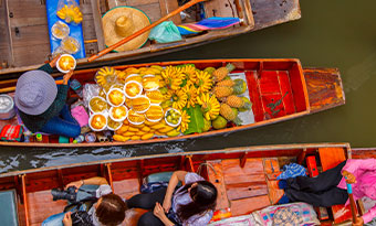 A boat selling fruit and vegetables at the floating markets in Bangkok, Thailand