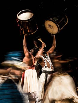 two uganan people performing music and dance for bayimba international festival of music and arts in uganda