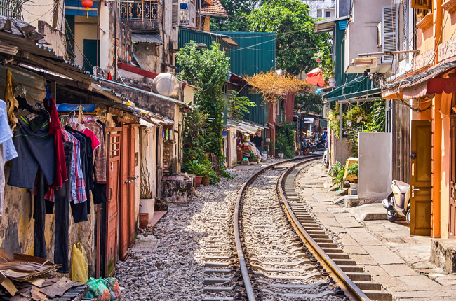 Experience the inexplicable as a train trundles through the middle of a city street