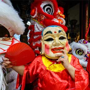 Travel tourist on holiday takes a photo on the Tet Festival parade