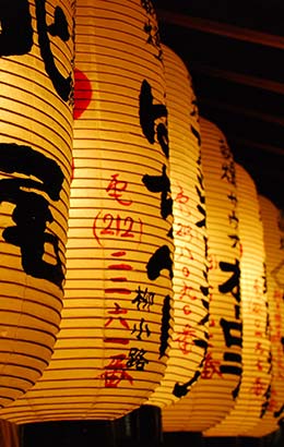 row of gold yellow paper lanterns on streets of nagasaki japan for nagasaki lantern festival