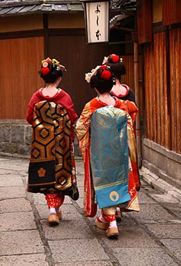 three geishas walking in gion kyoto japan for gion matsuri event in japan