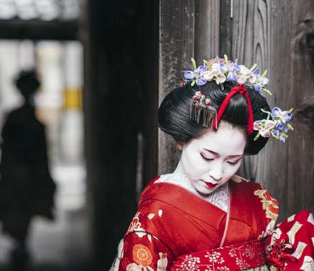 Maiko Geisha walking in the street of Gion Kyoto