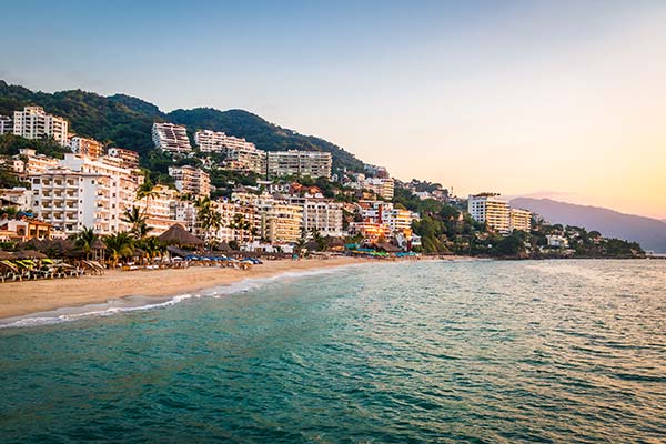 buildings and beaches lining the sea at puerto vallarta beach in mexico