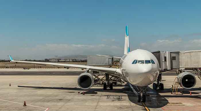 A plane sits on the tarmac at Cape Town International airport ready for boarding